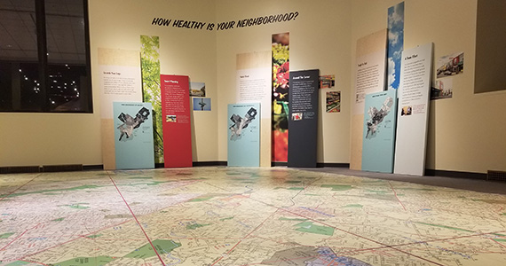 Image of Close to Home report maps at the Franklin Institute Giant heart exhibit